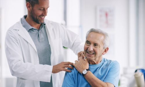 Doctor, elderly patient and shoulder pain with injury for checkup, exam or physiotherapy at hospital. Male person, medical worker and senior client with physiotherapist for muscle tension or relief Doctor, elderly patient and shoulder pain with injury for checkup, exam or physiotherapy at hospital. Male person, medical worker and senior client with physiotherapist for muscle tension or relief.