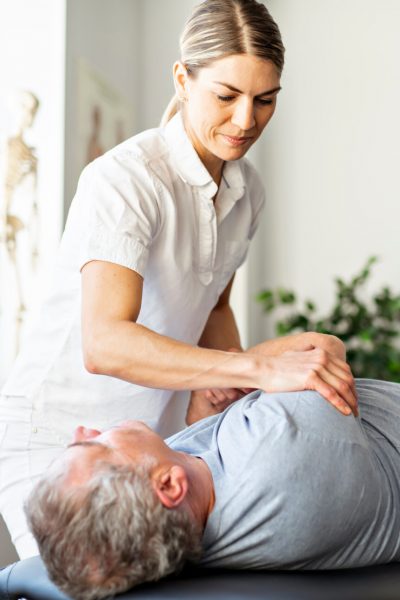 A Modern rehabilitation physiotherapy worker with senior client Modern rehabilitation physiotherapy worker with senior client